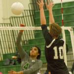 Kentridges Zaiah Calvin fires a shot past Kentlakes Chloe Hawker during Thursdays match. She had 12 kills and four digs in the three-game victory. MARK KLAAS, Kent Reporter