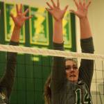 Kentridges Madeline Gooding, right, and a teammate reach to block a shot during the Chargers sweep of Kentlake in a North Puget Sound League Cascade Division match Thursday night. MARK KLAAS, Kent Reporter