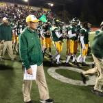 Kentridge coach Brett Ogata walks off the field after his teams win against Auburn on Friday night at French Field. MARK KLAAS, Kent Reporter