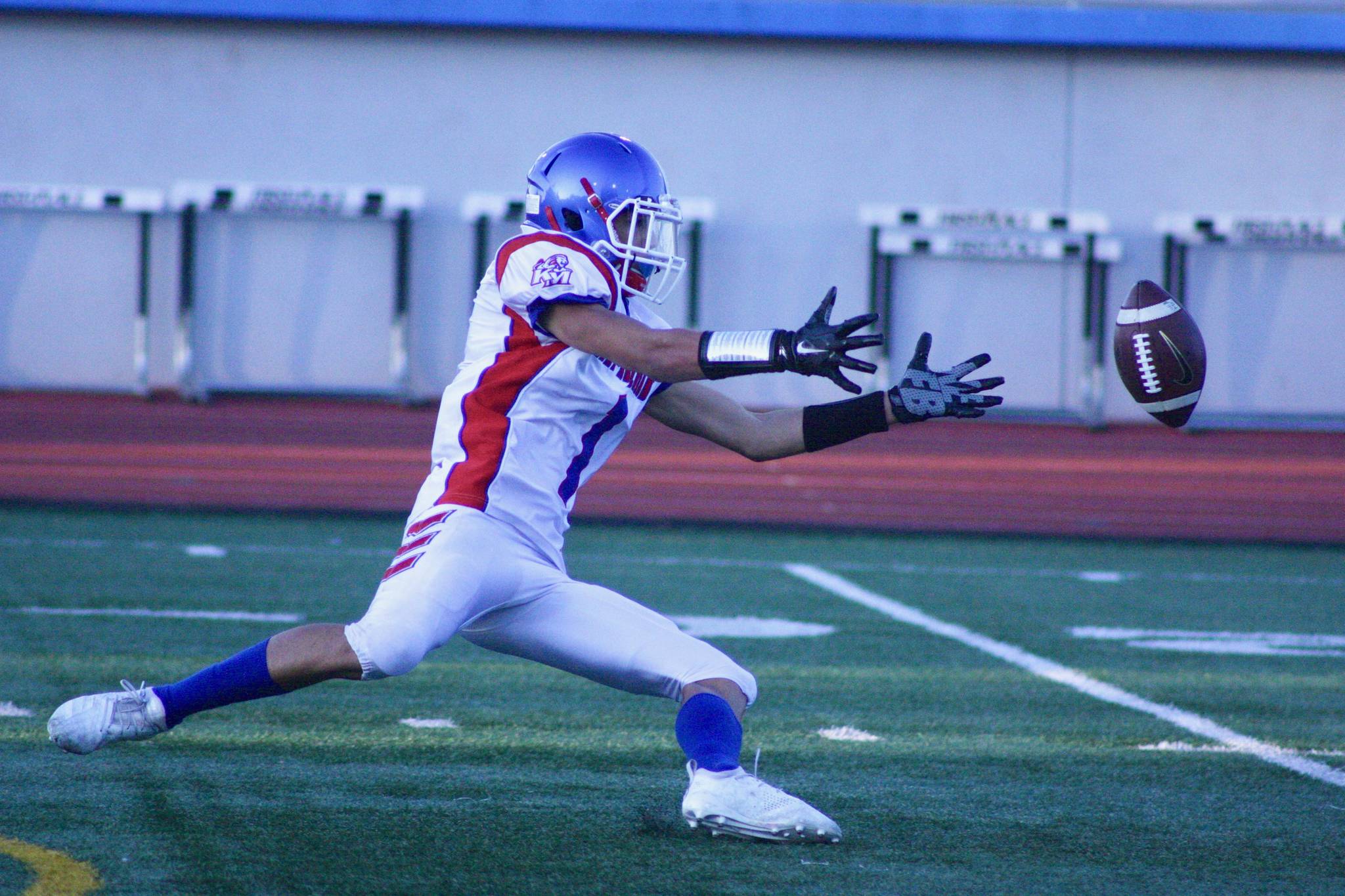 Kent-Meridians Ronald Wilson III has trouble fielding the ball on a kickoff return against Mount Rainier in an NPSL game Friday at Highline Stadium in Burien. MARK KLAAS, Kent Reporter