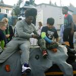 Seattle Seahawks linebacker Shaquem Griffin joins kids on a new climbing rock Tuesday at Park Orchard Elementary School in Kent. STEVE HUNTER, Kent Reporter