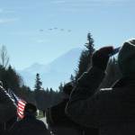 Stearman World War I vintage biplanes, led by pilot Rich Aldridge, approach to fly over Tahoma National Cemetery as honored guests stand during the Veterans Day ceremony last Sunday. SARAH BRENDEN, Covington-Maple Valley Reporter