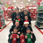 Kent Police officers and staff participated in Targets Heroes Helpers program last year to help children purchase gifts for their families. COURTESY PHOTO, Kent Police