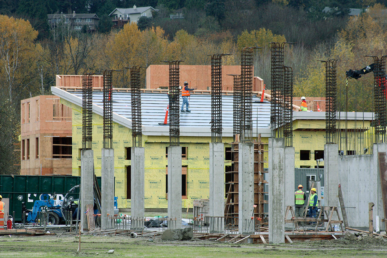 Crews work last week on the Marquee on Meeker mixed-use project on the former Riverbend 
par 3 golf course. When complete, the project will feature 492 apartments and 12,000 square feet of retail space. MARK KLAAS, Kent Reporter