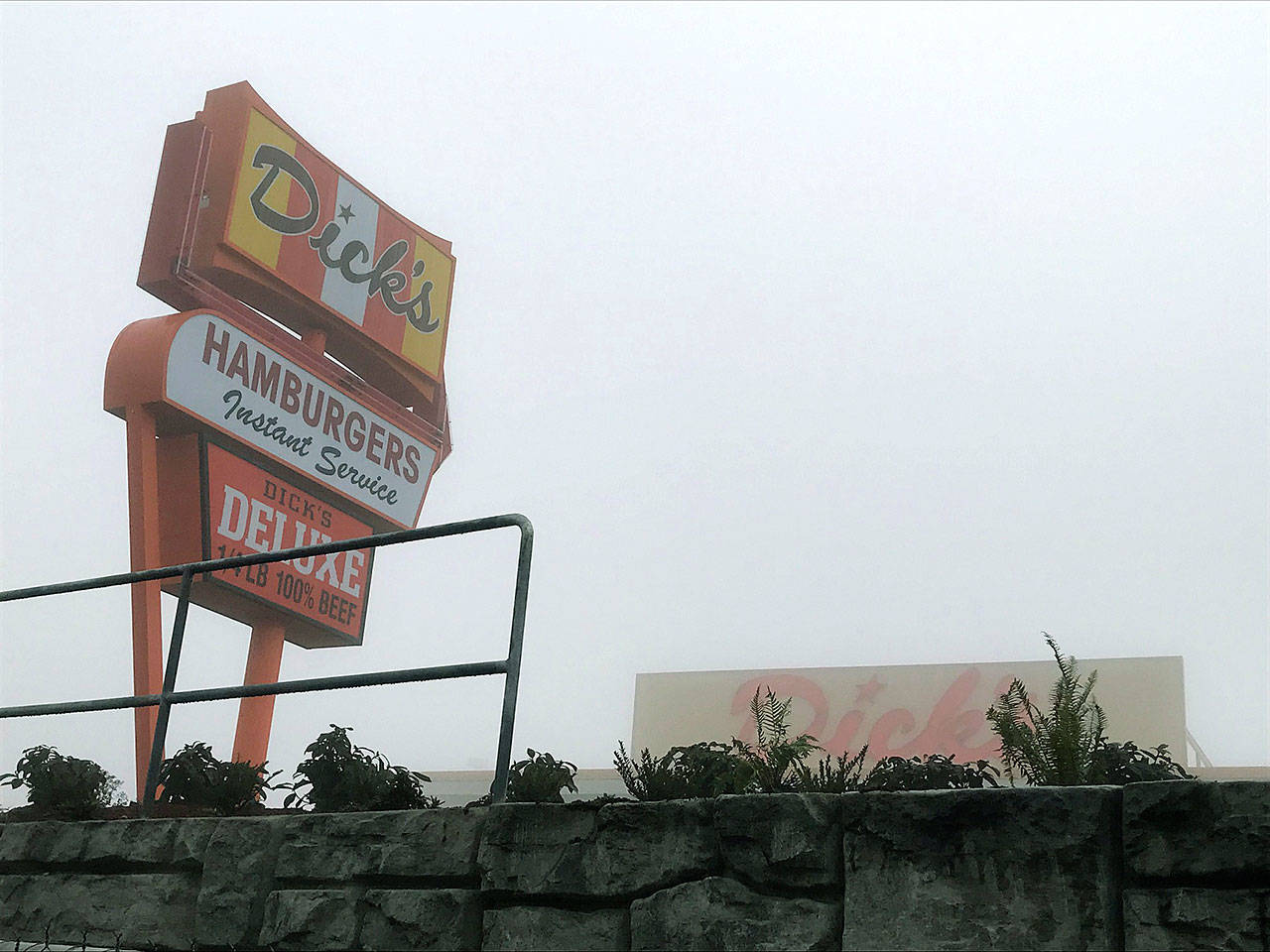 The new Dicks Drive-In off Pacific Highway South in Kent stands shrouded in the Tuesday morning fog as construction nears full completion before its Dec. 12 grand opening. REPORTER PHOTO