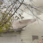 Firefighters rescue woman from Kent house fire