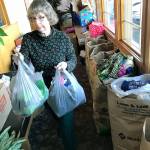 Barbara DeChene of Willows Place helps organize the mass collection of clothing and items during last years luncheon. MARK KLAAS, Kent Reporter