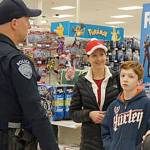 Children shop with a cop at Kent Target store