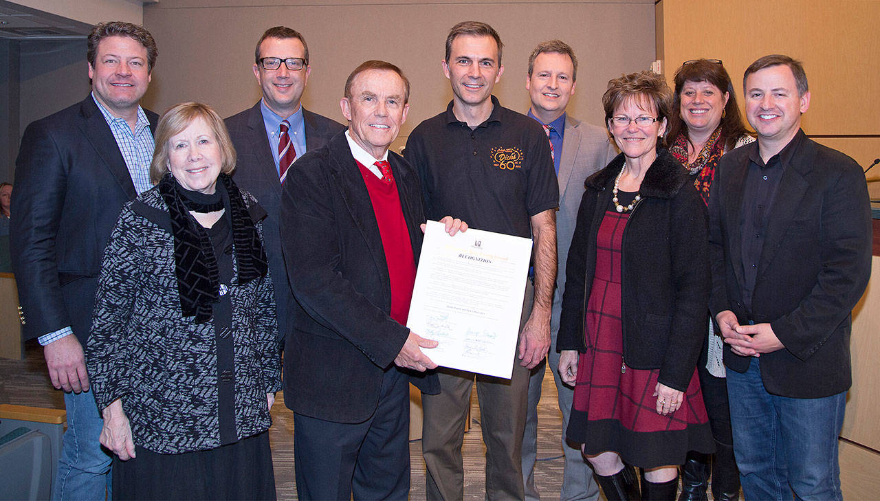 King County Council members join Ron Schmeer (center) of Dicks Drive-In, from left to right, Reagan Dunn, Jeanne Kohl-Welles, Joe McDermott, Pete von Reichbauer, Schmeer, Dave Upthegrove, Kathy Lambert, Claudia Balducci and Rod Dembowski. The council on Monday recognized Dicks for its community service. COURTESY PHOTO, King County Council