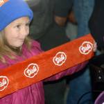 Bryn Holt, 6, helps celebrate the grand opening Wednesday in Kent of Dicks Drive-In. STEVE HUNTER, Kent Reporter