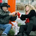 Ed Covello and LaRee Lewis enjoy a meal under the Dicks Drive-In sign during the grand opening Wednesday morning at the new Kent location on Pacific Highway South. STEVE HUNTER, Kent Reporter