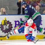 Thunderbirds winger Dillon Hamaliuk tries to drive the puck up the ice as Chiefs defenseman Luke Gallagher provides resistance during WHL play Friday night. COURTESY PHOTO, Brian Liesse, T-Birds