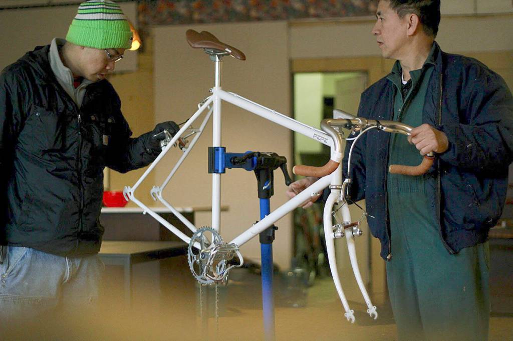Sang, left, and Ronnie are students in a three-month training program that will prepare them for entry-level jobs at bike shops or to act as a resource for their communities. COURTESY PHOTO, Margo Vansynghel
