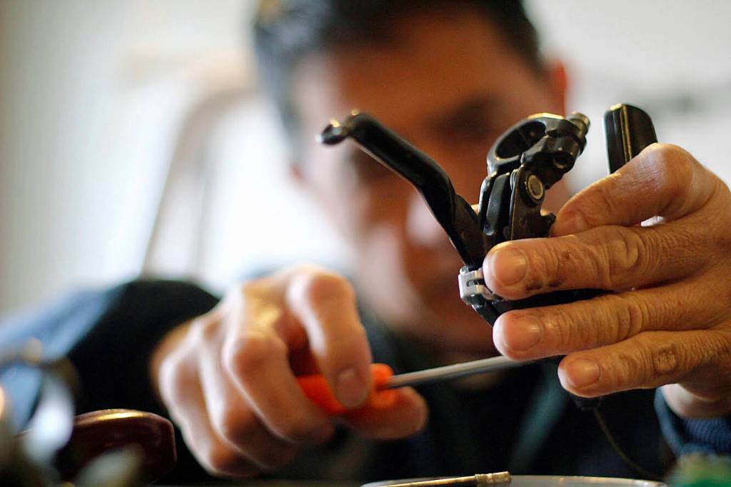 Students learn different aspects of bike repair, 
maintenance and restoration at the downtown Kent shop. COURTESY PHOTO, Margo Vansynghel