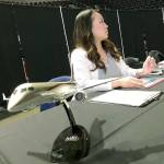 Hiromi Parcasio, a recuiter for Mitsubishi Aircraft Corporation America, Inc., awaits the next job-seeking customer during the AFA Aerospace Job Fair. MARK KLAAS, Auburn Reporter