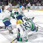 Players have fun while gathering the furry donations from the Fred Meyer Teddy Bear Toss Night presented by WARM 106.9 FM. COURTESY PHOTO, Brian Liesse, T-Birds