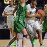 Kentridges Dayla Ballena drives on Woodinvilles Katie Minnehan. RACHEL CIAMPI, Kent Reporter
