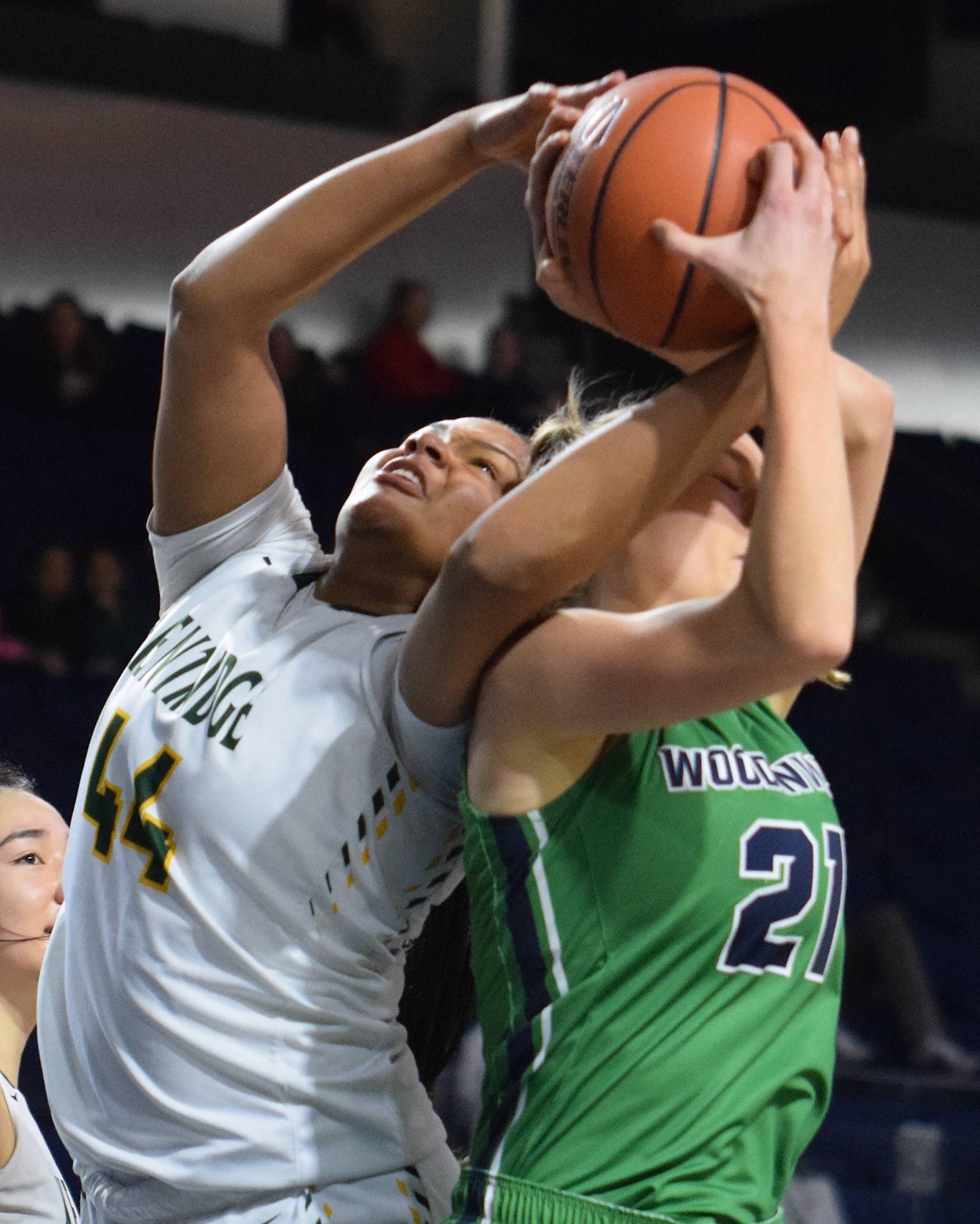 Kentridges JaQuaya Miller, left, and Woodinvilles Morgan Lundquist battle for a rebound during the Eric Anderson Classic girls basketball game Monday at the accesso ShoWare Center. RACHEL CIAMPI, Kent Reporter