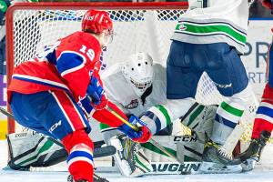 Thunderbirds goalie Roddy Ross makes one of his 34 shots in a 2-1 Western Hockey League win over Spokane on Tuesday night. COURTESY PHOTO, Brian Liesse, T-Birds