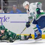 The Thunderbirds Andrej Kukuca tries to advance the back past fallen Silvertip Connor Dewar during WHL action at the accesso ShoWare Center on Friday night. COURTESY PHOTO, Brian Liesse, T-Birds