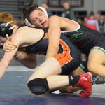 Kentwoods 113-pound freshman Wylder Kraght, right, takes on Davis Dominic Sowers during consolation round action at Mat Classic XXXI. Kraght won by a 7-2 decision. He later wound up sixth in the weight class. RACHEL CIAMPI, Kent Reporter