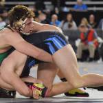 Kentwoods 195-pound sophomore Dominic Kremer, top, tangles with Central Valley of Spokanes Cade Byus during consolation round action at Mat Classic XXXI. Kremer won by a 1-0 decision to finish seventh in his weight class. RACHEL CIAMPI, Kent Reporter