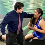 Kent-Meridian coach Jesus Valdez talks to Ofa He Lotu Tuifua after the sophomore captured the 190-pound title at Mat Classic XXXI. MARK KLAAS, Kent Reporter