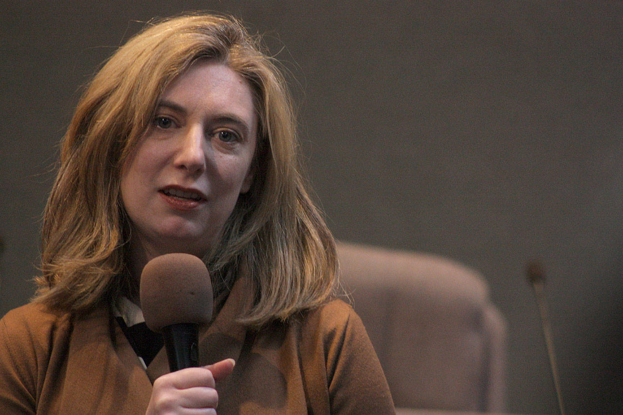 Diane Oakes talks about the legacy and work of her late father, former Washington Gov. Mike Lowry, during a ceremony at City Hall on Monday. Oakes and her family were on hand to recognize the work of three organizations in reducing homelessness. The family established the Lowry Fund to End Homelessness to support the work done in local communities. MARK KLAAS, Kent Reporter