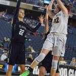 Kentridges Kiernen Denckla drives to shoot over two Bellarmine Prep defenders, including Julia Bordeaux (22), during 4A Hardwood Classic consolation-round play at the Tacoma Dome on Saturday. Denckla came off the bench to score 10 points to help the Chargers to a 70-60 win and a third-place finish at the state tournament. RACHEL CIAMPI, Kent Reporter