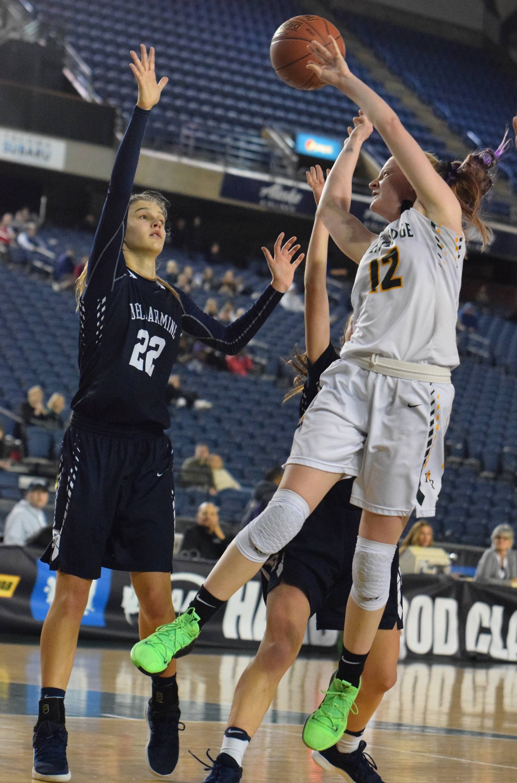 Kentridges Kiernen Denckla drives to shoot over two Bellarmine Prep defenders, including Julia Bordeaux (22), during 4A Hardwood Classic consolation-round play at the Tacoma Dome on Saturday. Denckla came off the bench to score 10 points to help the Chargers to a 70-60 win and a third-place finish at the state tournament. RACHEL CIAMPI, Kent Reporter