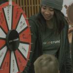 Katherine Nguyen, representing Powercrunch, has visitors spin the wheel of fortune. MARK KLAAS, Kent Reporter