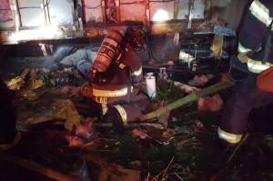 Firefighters douse a mobile home fire late Thursday. The occupants safely evacuated. COURTESY PHOTO, Puget Sound RFA