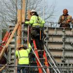 Crews work on a new apartment complex at the southwest corner of West Meeker Street and 64th Avenue South. MARK KLAAS, Kent Reporter