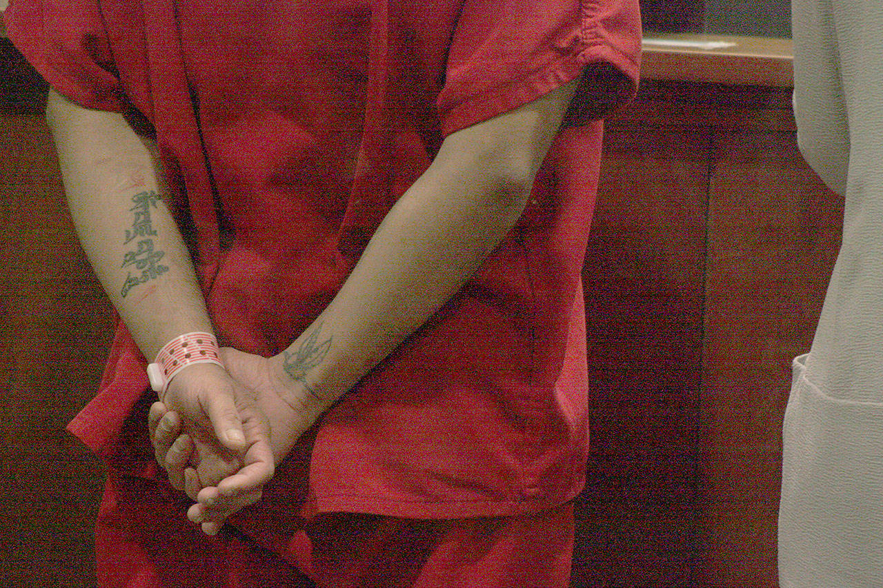 A handcuffed Gurkeerat Kainth appears before Judge Johanna Bender for his arraignment in King County Superior Court on Thursday. MARK KLAAS, Kent Reporter