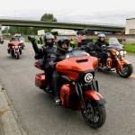Harley-Davidson riders leave the Manheim Seattle Auto Auction parking lot in Kent on Friday, following 77th Avenue South out to the Valley Freeway. The field went eastbound on Highway 18 then eastbound on Interstates 90, 82 and 84 to Ontario, Ore., the first of nine stops on the Charity Ride Across America. MARK KLAAS, Kent Reporter