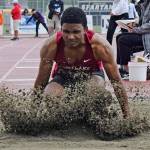 Kentlakes Justice Etafo scatters the sand after his attempt in the long jump at the bi-district meet. Etafo finished second with a leap of 22 feet, ½ inch. RACHEL CIAMPI, Kent Reporter