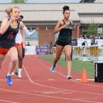 Kentwoods 800-meter relay captured the bi-district title in 1:41.50. Here, Faith Marshall passes the baton to MaKayla Williams, far right. RACHEL CIAMPI, Kent Reporter