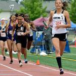Kentwoods Emma Pollak brings home the victory in the girls 800-meter relay at the 4A finals last Saturday. RACHEL CIAMPI, Kent Reporter