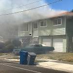 Fire breaks out at a Kent house Monday afternoon in the 10500 block of Southeast 236th Place. COURTESY PHOTO, Puget Sound Fire