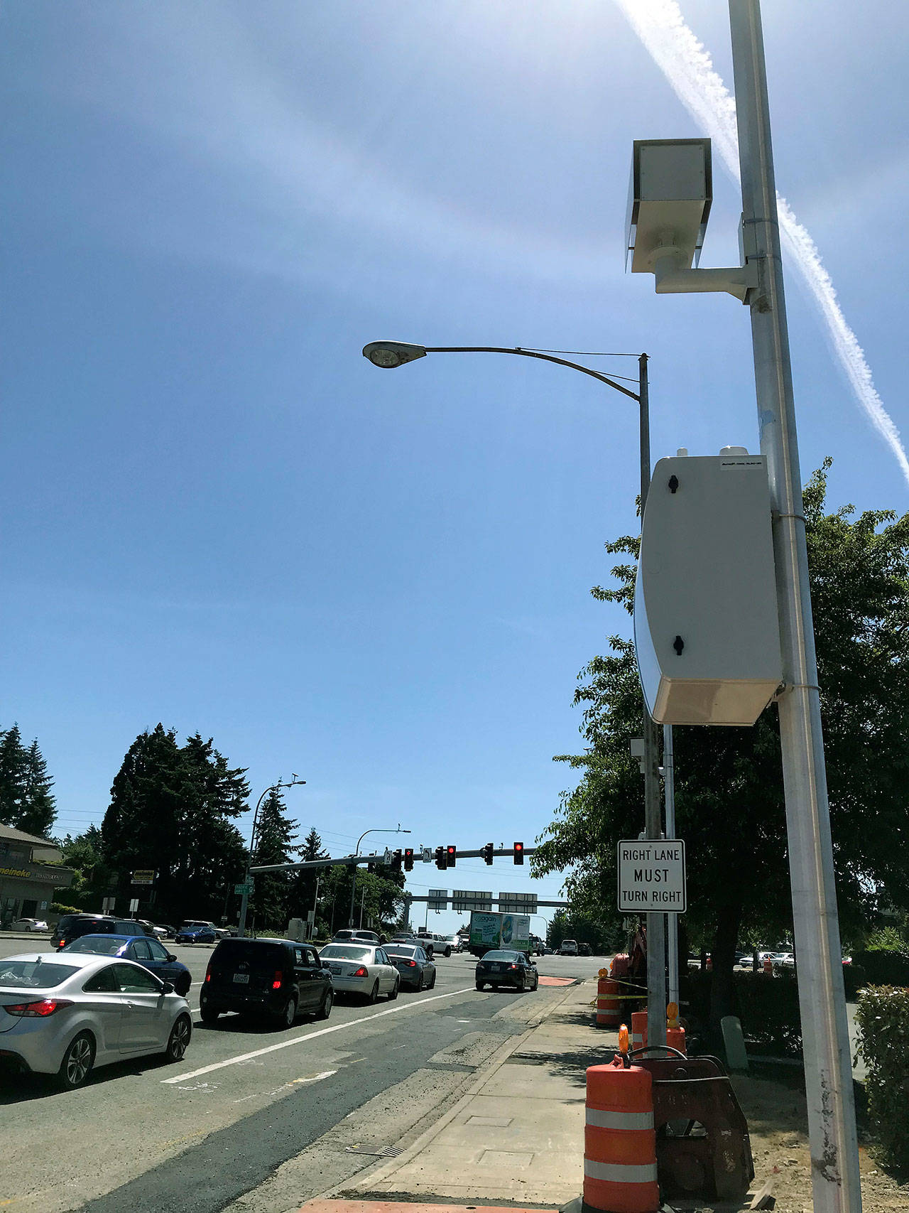 Crews recently installed a camera to capture drivers running red lights while eastbound on Kent Des Moines Road at the intersection of Pacific Highway South. Kent Police will issue warnings starting July 1 and $136 tickets starting Aug. 1. MARK KLAAS, KENT REPORTER