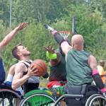 Sean Maloney looks to shoot while attracting a crowd during wheelchair division play. MARK KLAAS, Kent Reporter