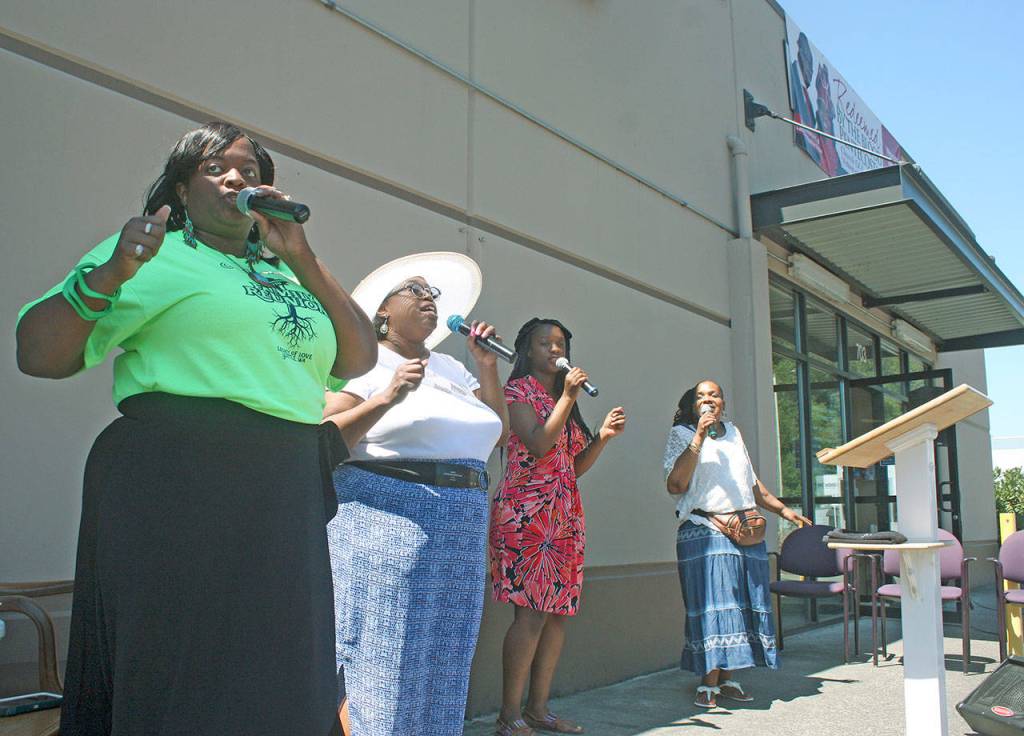 Lady Jacqualine Boles, far left, and the praise team perform at the service. MARK KLAAS, Kent Reporter