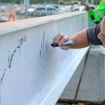 Muckleshoot Tribal Council Chair Jaison Elkins places his signature on the final structural beam for phase 1 of the casinos expansion. COURTESY PHOTO, Muckleshoot Tribe