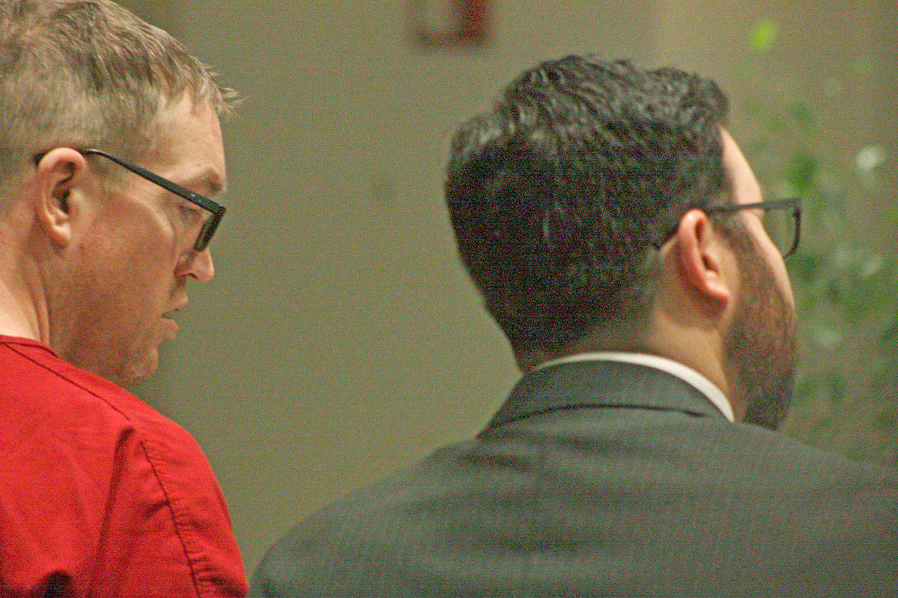 Nicholas Slater, left, listens in as his attorney, Deputy Public Defender Michael Schueler, talk to King County Superior Court Judge Karen Donohue during Slaters arraignment for vehicular homicide on Monday, March 18 in Kent. MARK KLAAS, Kent Reporter