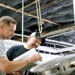 Kent Police Chief Rafael Padilla, right, and Sgt. Jason Bishop adds ingredients to the 2K56 Beer at Airways Brewing Co. on July 15. COURTESY PHOTO, Airways Brewing Company
