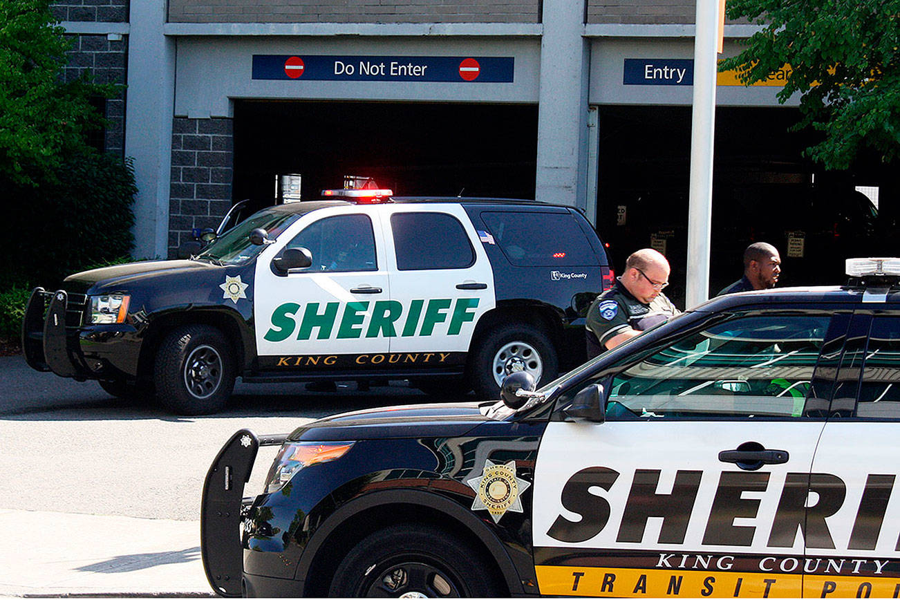 FILE PHOTO: King County Sheriffs Office deputies block off access to the Kent Station parking garage after a deputy shot and killed a suspect in a reportedly stolen Honda Civic in 2018.