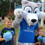The mascot of the Carriage Crest Elementary School Coyotes poses with students on the first day of school Thursday in the Kent School District. COURTESY PHOTO, Kent School District