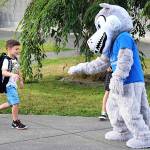 The mascot of the Carriage Crest Elementary School Coyotes greets a student on the first day of school Thursday in the Kent School District. Carriage Crest is in Renton. COURTESY PHOTO, Kent School District