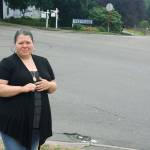 Sarah Kier stands near the intersection of Reith Road and Lake Fenwick Road South where her brother was struck and killed Aug. 23 by a pickup driver. Kier says the city of Kent needs to improve safety at the intersection. STEVE HUNTER, Kent Reporter
