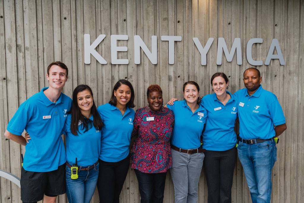 Kelly Guy, the Kent YMCAs executive director, fourth from left, and staff. COURTESY PHOTO, Brandon Patoc (patoc.co)
